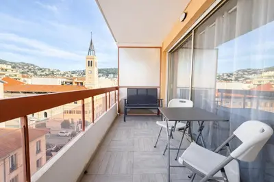 a balcony with a table and chairs and a view at Smolett 2 Pers Terrazza WiFi in Nice
