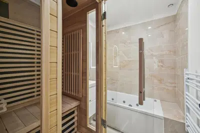 a bathroom with a tub and a walk in shower at Lavie Maison Hot Tub and AC in Nice