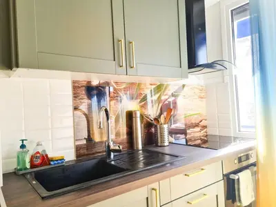 a kitchen with a sink and a counter top at Charmant appartement - Climatisation - Nice in Nice