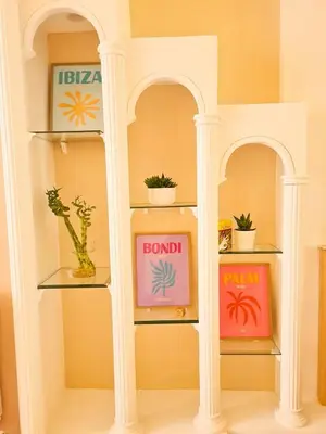 a room with two shelves with potted plants on them at Charmant appartement - Climatisation - Nice in Nice