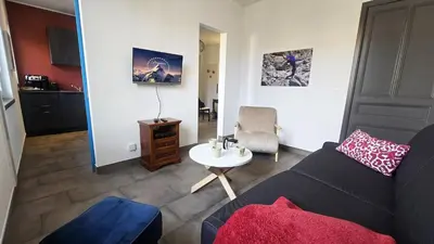 a living room with a couch and a table at 
