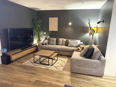 a living room with two couches and a flat screen tv at Villa moderne pour 8 personnes - Vue sur Nice ! in Nice