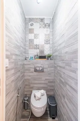 a bathroom with a white toilet in a room at Sea View & Promenade des Anglais Studio in Nice