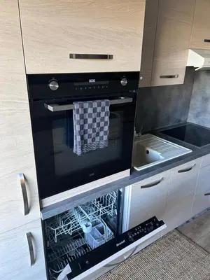 a kitchen with an oven with a dishwasher at Olympie, airport, train and tram station Fully equipped for 3 peoples in Nice