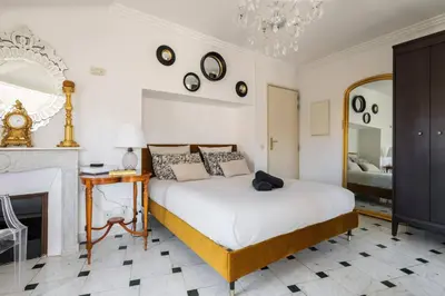 a bedroom with a bed and a fireplace at Perchoir au coeur de Nice in Nice