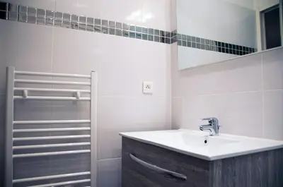 a bathroom with a sink and a shower at Apartment Massena in Nice