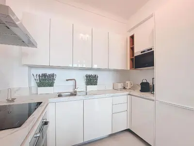a white kitchen with white cabinets and a sink at Nestor&Jeeves - ORANGE - Central - Near Sea in Nice