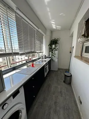 a large kitchen with sinks and a washing machine at Nice Excepetional view in Nice