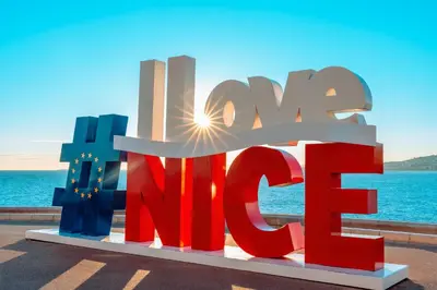 a sign with the word amr in front of the ocean at Studio au cœur de Nice lumineux in Nice