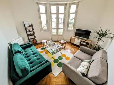 a living room with two couches and a television at Cosy appartement in Nice city center in Nice