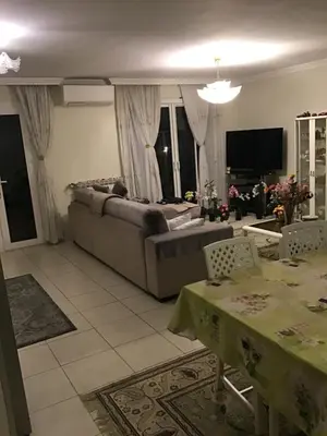 a living room with a couch and a table at Nice port quartier antiquaire in Nice