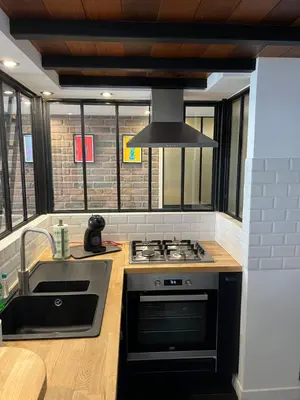 a kitchen with a stove and a sink at loft riviera in Nice