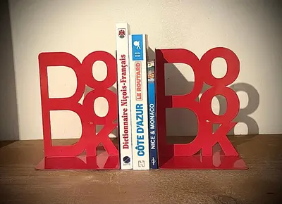 three books standing next to each other on a table at Cosy Family trip in Nice