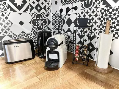 a kitchen counter with a toaster and a toaster and a toaster at Cosy Family trip in Nice