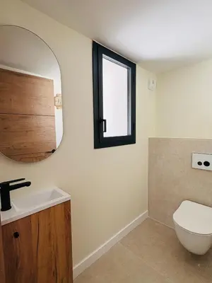 a bathroom with a toilet and a mirror at L'Esprit Sud, 4 Suites & Piscine Chauffée in Vence