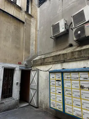 a building with a door and a air conditioner at Studio climatisé in Nice
