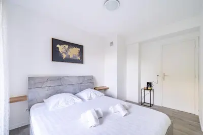 a bedroom with a white bed with two white pillows at Superbe 3 pieces Nice 100m de la mer in Nice