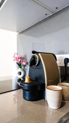 a coffee maker sitting on a counter in a kitchen at Superbe studio front de mer in Saint-Laurent-du-Var