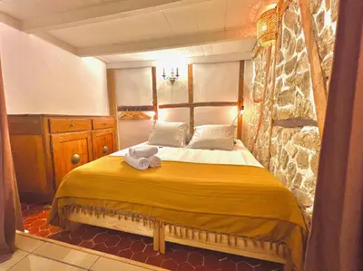 a bedroom with a bed with a towel on it at ApartHotel Riviera - MAISON DU CHATEAU - Old town - Promenade des Anglais in Nice