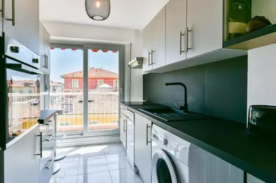 a kitchen with a sink and a dishwasher at Happyfew Fodere in Nice