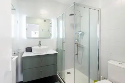 a bathroom with a sink and a glass shower at Happyfew Fodere in Nice