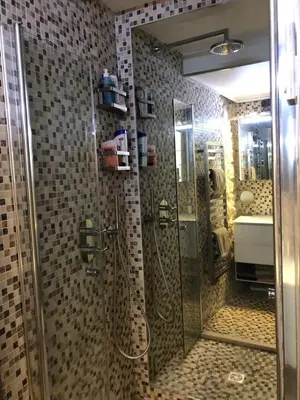 a bathroom with a shower with a glass door at COCON AP4446 By Riviera Holiday Homes in Villefranche-sur-Mer