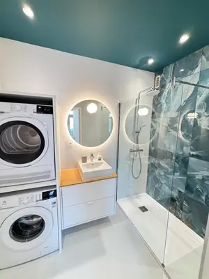 a bathroom with a washing machine and a sink at NICE La Palmeraie Pool BEACH AC in Nice