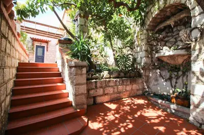 a set of stairs leading up to a house at CASA ROSALIE VI4442 By Riviera Holiday Homes in Villefranche-sur-Mer