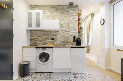 a kitchen with a washer and dryer at Ultra Central 1 Bdr - AC in Nice