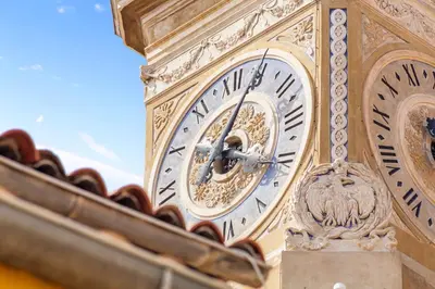 a clock on the side of a building at Saint-Augustin - Nice Old Town in Nice