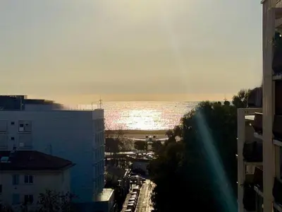 a view of the ocean from a city with buildings at Votre COCON Niçois Appart Vue Mer in Nice