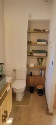 a bathroom with a white toilet in a room at Chambres d hôtes les Romarins in Cantaron