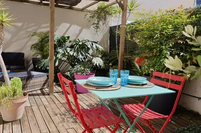 a table with plates and glasses on a patio at Studio with Big terrace full center with air conditioning in Nice