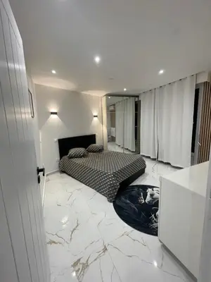a bedroom with two beds and a marble floor at Cozy appartment downtown Nizza 2 Bedroom 1 min Beach 1 min tramway 10min airport air conditionner in Nice