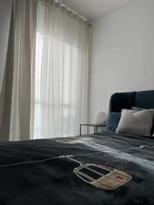 a bedroom with a bed and a large window at Appartement d'exception vue mer Nice Blue Pearl in Nice