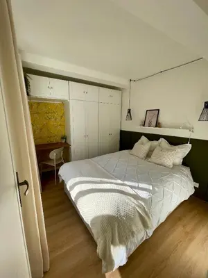 a bedroom with a large bed and a desk at Cosy 1 Bedroom Place Massena in Nice