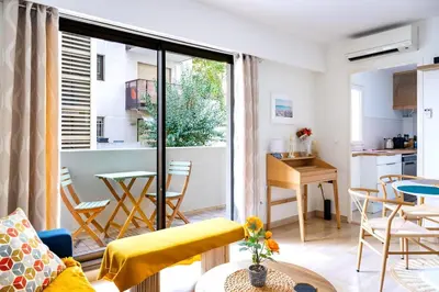 a living room with a couch and a table at Rivoli- Quiet apartment, close to Negresco in Nice