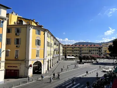 a group of people walking around a city street at Joli Studio Place Garibaldi, Vieux-Nice, Port in Nice