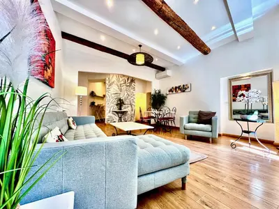 a living room with a couch and a table at ApartHotel Riviera - La Maison De Francois - Old Town in Nice