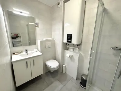 a bathroom with a toilet and a sink and a shower at ApartHotel riviera - Balcon Jean Jaures 2 - Place Massena - Old in Nice