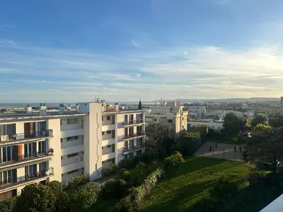 a view of a city from a building at Cocon Azur avec vue panoramique sur mer - 4 chambres in Nice