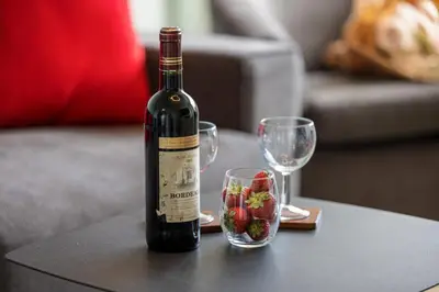 a bottle of wine and two glasses on a table at MY CASA - MEDECIN 26 - Superb Apt Suite Downtown in Nice
