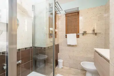 a bathroom with a glass shower and a toilet at MY CASA - MEDECIN 26 - Superb Apt Suite Downtown in Nice