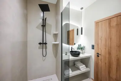 a bathroom with a shower with a glass door at Beautiful apartment, old nice in Nice