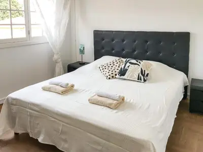 a bedroom with a large bed with two towels on it at Lympia - one bedroom apartment near the port in Nice