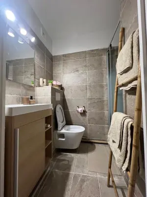 a bathroom with a toilet and a sink at Studio Boho Chic - Proche de la mer in Nice