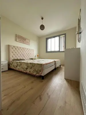 a bedroom with a large bed in a room at Jolie appartement à Nice in Nice