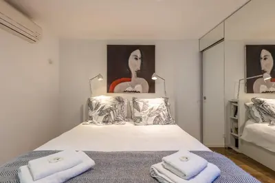 a bedroom with a bed with two towels on it at Villa Margot ' Exceptional Place in Villefranche-sur-Mer