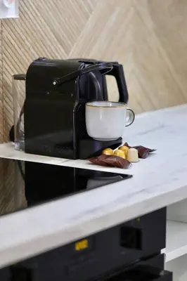 a coffee maker sitting on top of a counter at Magnifique appartement proche mer in Nice