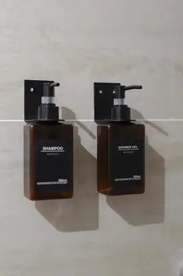 two bottles of soap sitting on top of a counter at Magnifique appartement proche mer in Nice